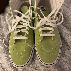 Leather and canvas women’s size 9 Vans high tops. Only worn once or twice.